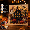An art kit featuring a diamond painting of a spooky Halloween castle with spiders and pumpkins on a canvas.