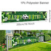 A green polyester banner with Happy Birthday text and soccer balls displayed outdoors in a garden setting.