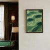 A framed canvas print depicting a green golf course landscape with small figures playing golf.
