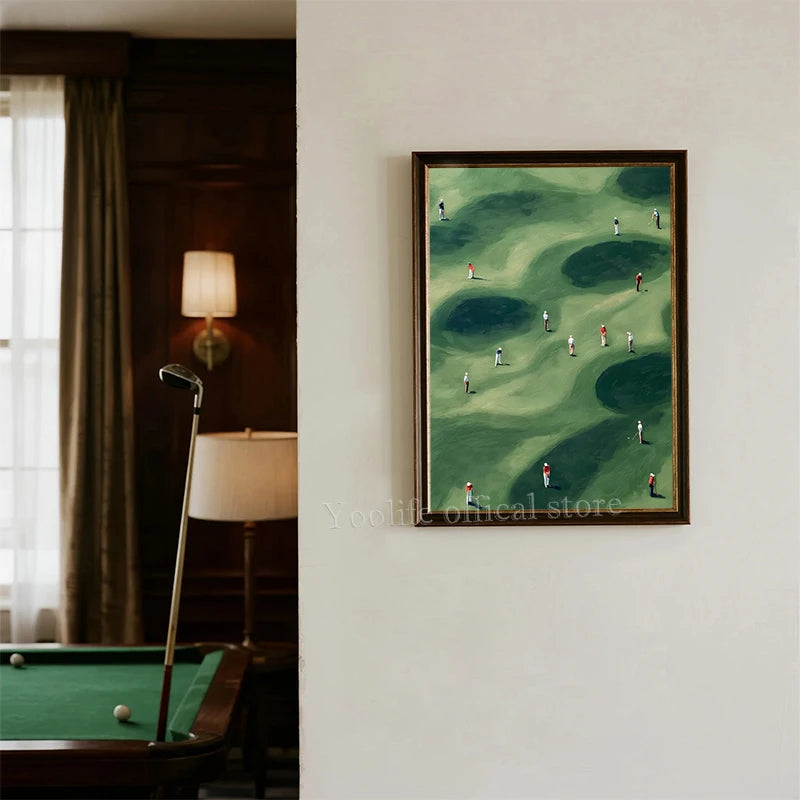 A framed canvas print depicting a green golf course landscape with small figures playing golf.