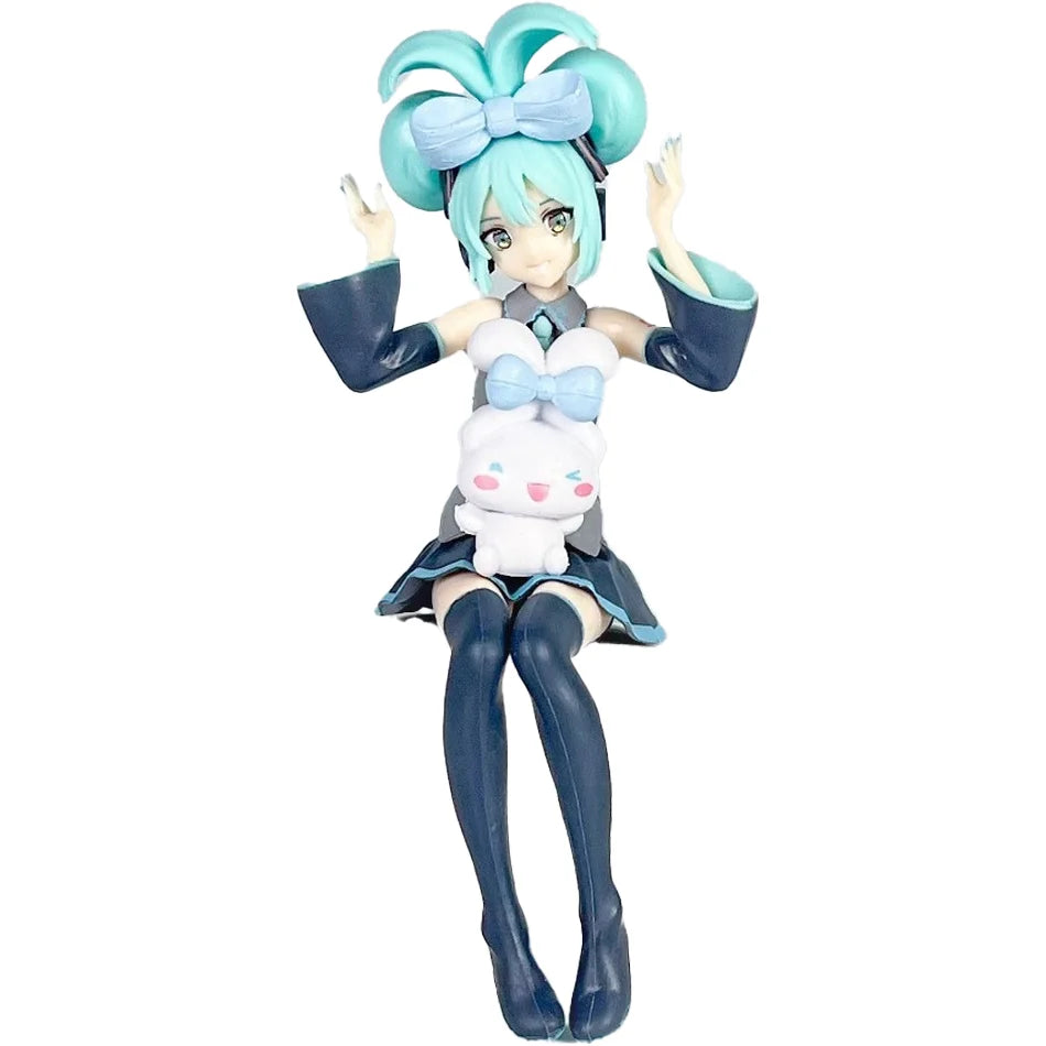 A PVC collectible figurine of Hatsune Miku with light blue hair, wearing a sailor outfit and a white bunny accessory.