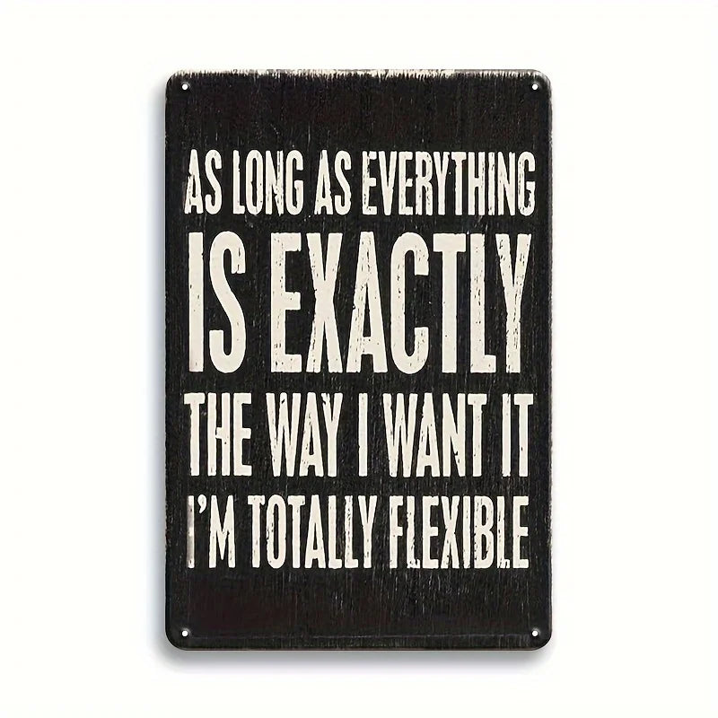 A black metal tin sign with white text that reads As long as everything is exactly the way I want it I'm totally flexible