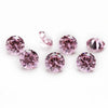 A collection of round cut pink and purple cubic zirconia loose stones for jewelry making.