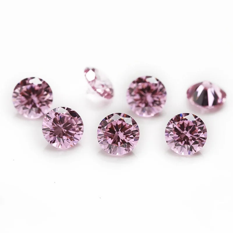 A collection of round cut pink and purple cubic zirconia loose stones for jewelry making.