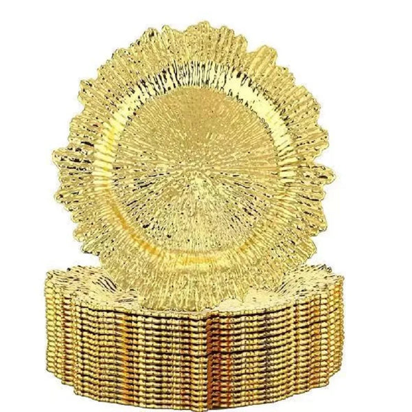 Elegant gold charger plates with a textured, sunburst design.