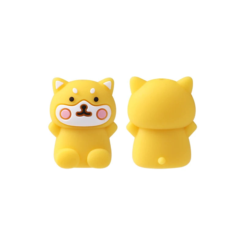 Two yellow silicone plant beads shaped like cats for jewelry making and DIY crafts
