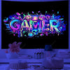 A vibrant, colorful, splatter-style graphic spelling the word GAMER in neon and holographic colors against a black background