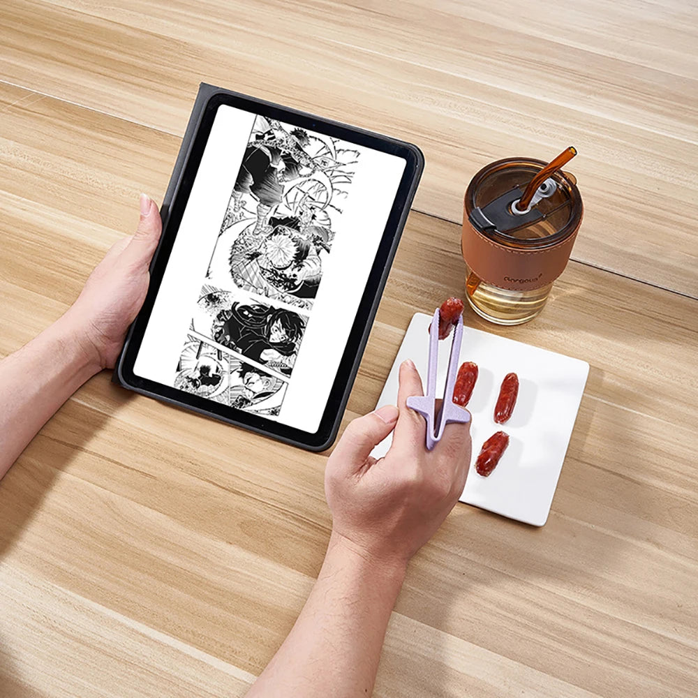 A hand holds a tablet displaying an illustration of reusable wheat straw finger chopsticks next to a glass of iced beverage a