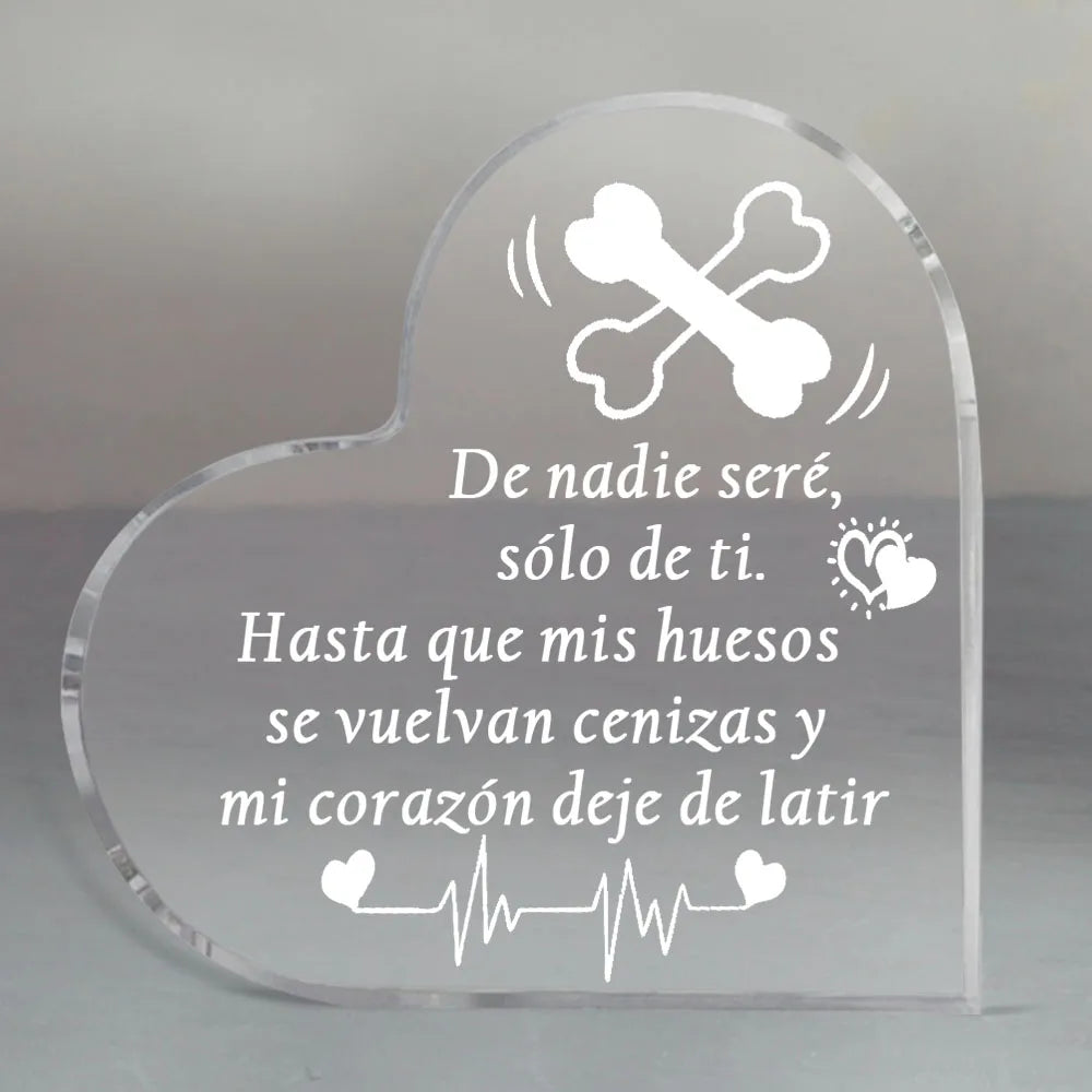 Clear heart-shaped glass keepsake with engraved text and a bone design