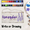 A wooden sign with the word lavender written in purple script, displayed next to a palette of paint colors.
