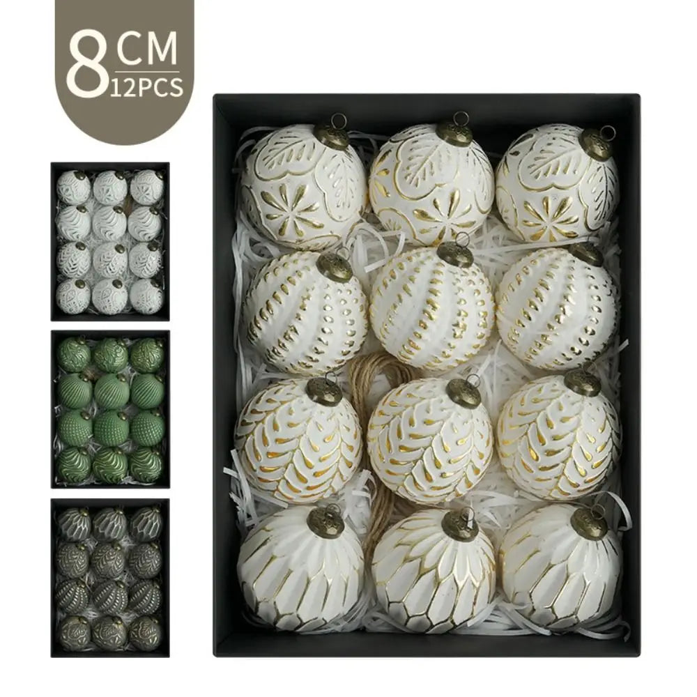 A set of twelve white and gold retro shatterproof Christmas tree ball ornaments displayed in a black box.