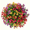 A vibrant bouquet of mixed artificial daisy flowers in shades of pink, purple, yellow, and red.