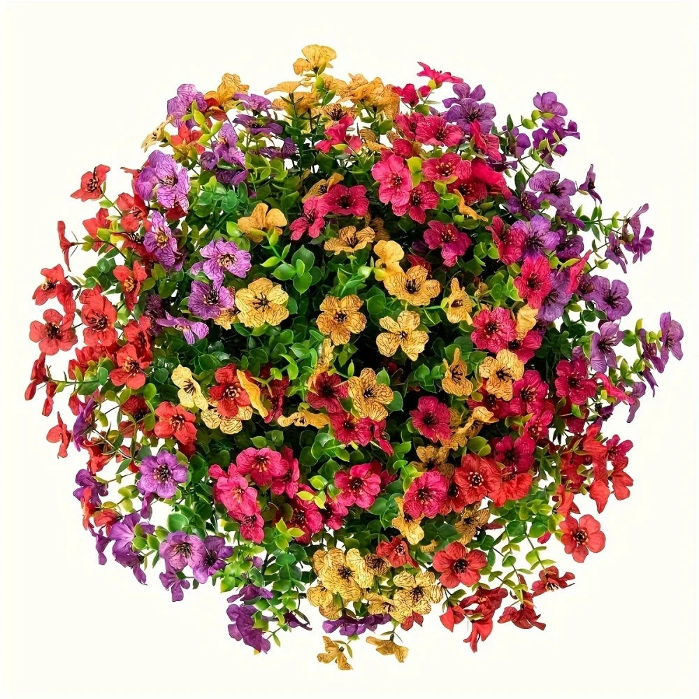 A vibrant bouquet of mixed artificial daisy flowers in shades of pink, purple, yellow, and red.
