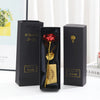 A set of metallic foil rose flowers in black display boxes with a card and golden rose details