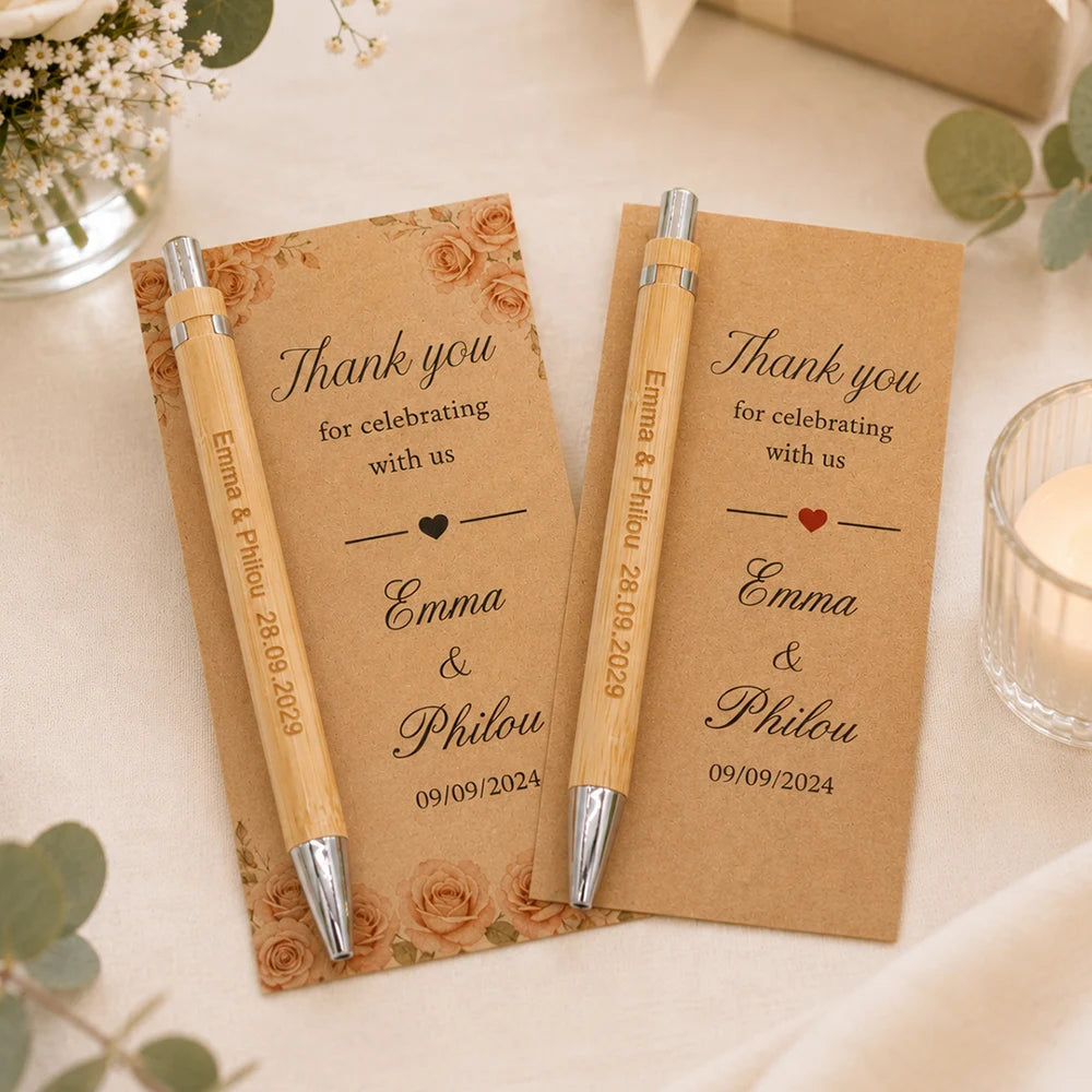 Two kraft paper thank you cards with engraved bamboo pens for Emma & Philou wedding.