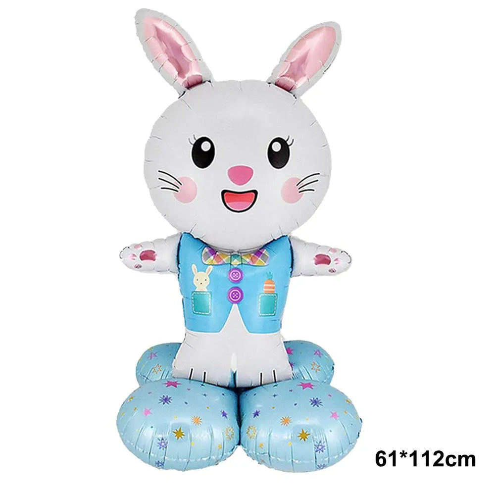 A white cartoon bunny foil balloon with pink inner ears and a blue outfit.
