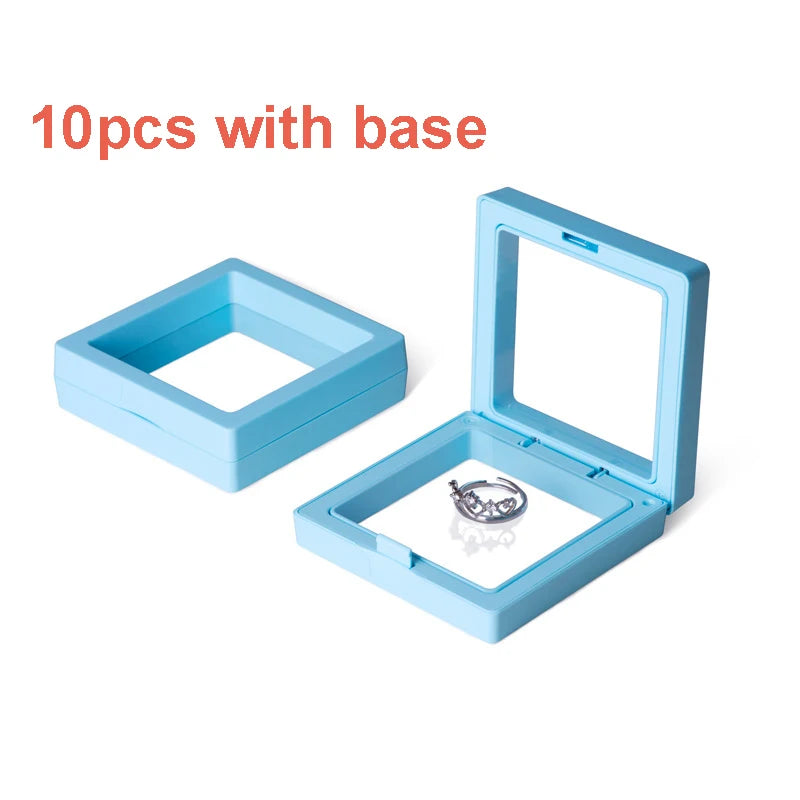 A light blue floating shadow box jewelry display frame with 10 gift boxes and a base.