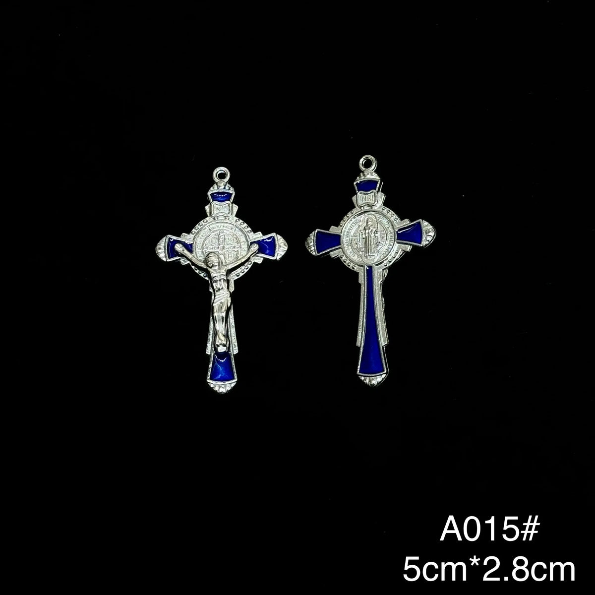 A pair of silver crucifix pendants with blue enamel finish.