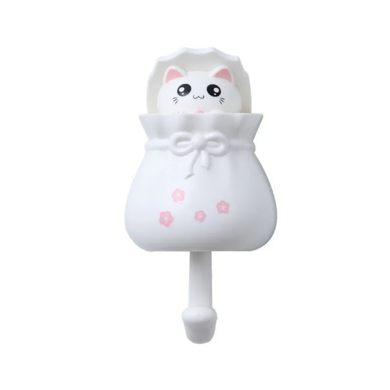 White cartoon cat wall hooks for organization with a bow detail