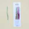 A package of 12 party candles featuring long, thin spiral birthday candles in various colors.