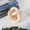 Hand carved light wood knot decor used as coffee table accent