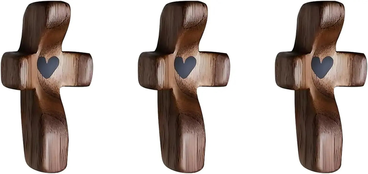 Three wooden comfort prayer crosses with a heart carved into the center.