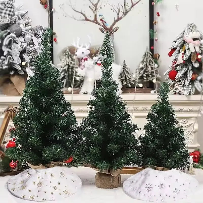 A festive display of plush faux fur Christmas trees in various shades of green and white.