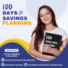 A woman holds a black binder titled IDD Envelopes Savings Planning with various savings challenge options visible.