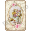 Vintage metal tin sign featuring a floral arrangement within an oval frame on aged paper.