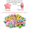 A pile of pink, green, and purple pentagram push pins with a box and a single pin shown.