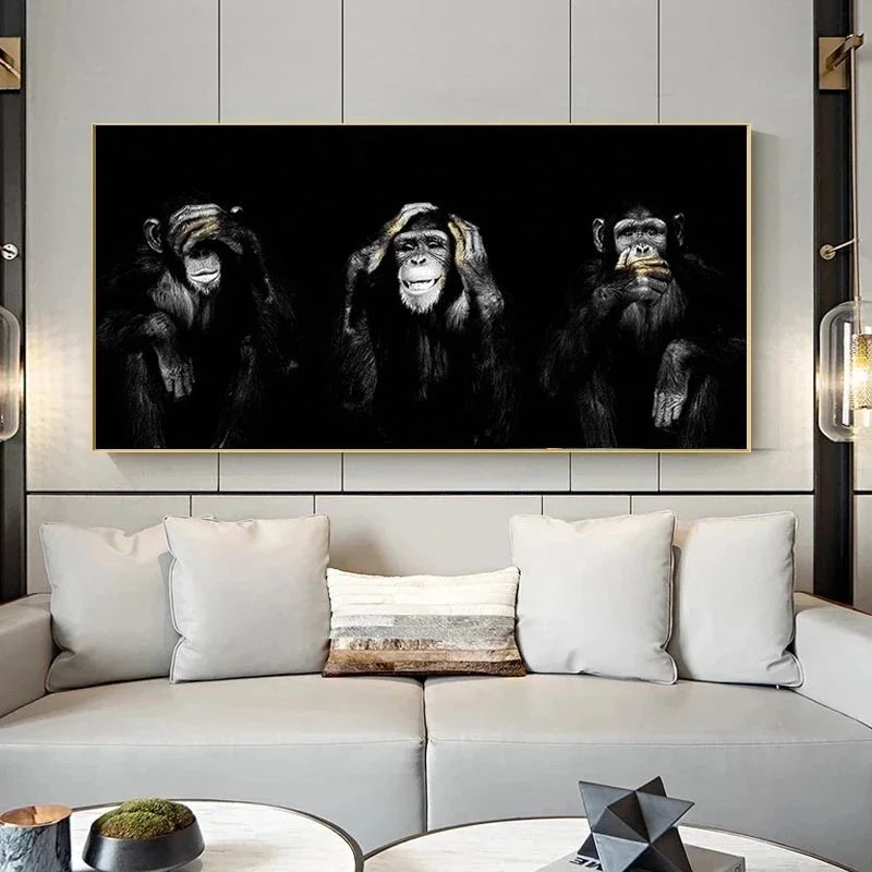A canvas wall art print featuring three black and white photographs of monkeys against a dark background.