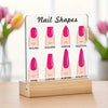 A display board showing various nail shapes like round, square, arrow, and stiletto on a wooden base.