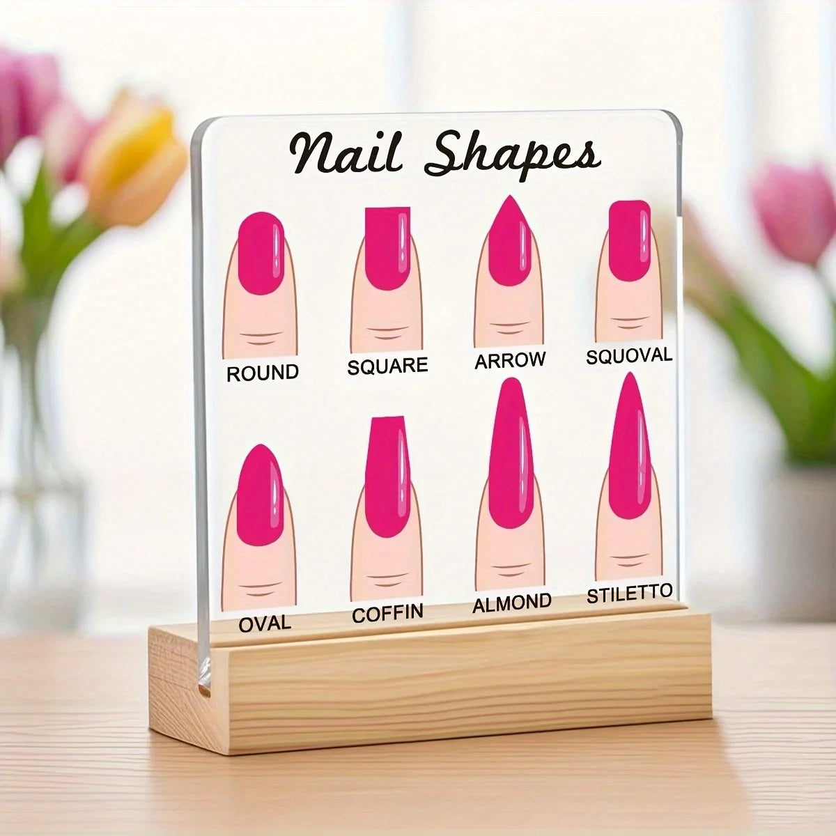 A display board showing various nail shapes like round, square, arrow, and stiletto on a wooden base.