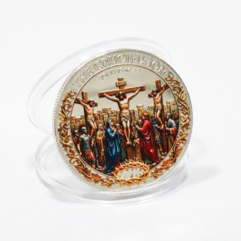 A silver commemorative coin depicting the crucifixion and resurrection scenes with biblical figures.