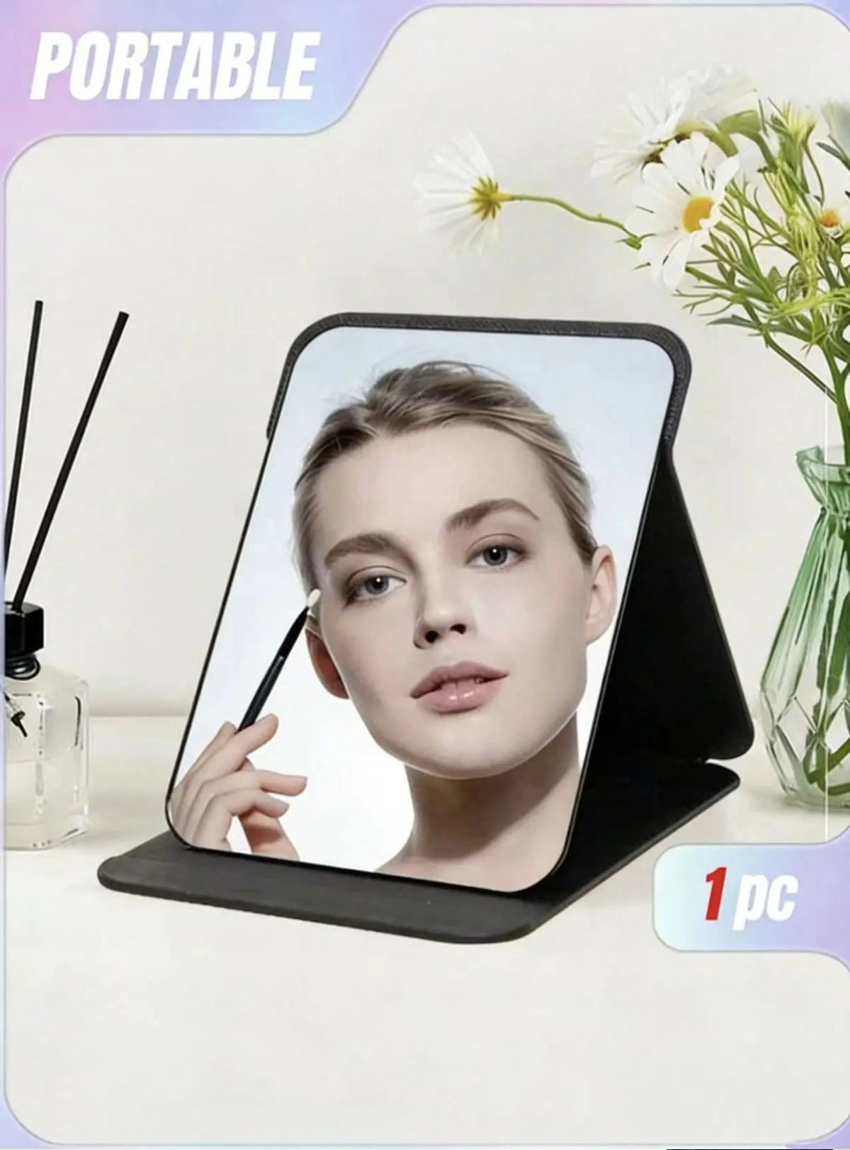 A portable foldable vanity mirror with an adjustable stand showing a woman's face.