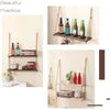 Rustic wooden hanging shelves with rope displaying various bottles and decorative items.
