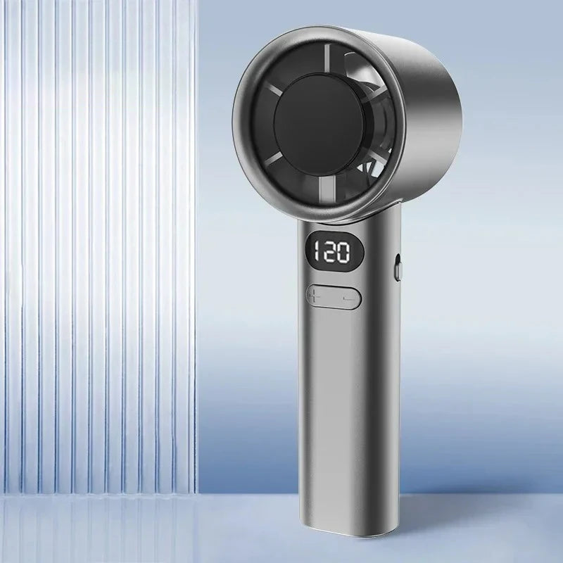 A silver handheld cooling fan with a circular grille and digital display showing 120 degrees.