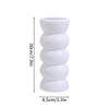 Modern white plastic decorative vase with stacked, rounded segments.