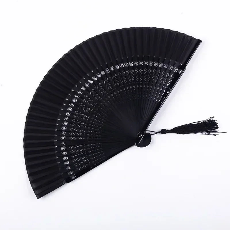 A black traditional Chinese folding fan with a pleated design.