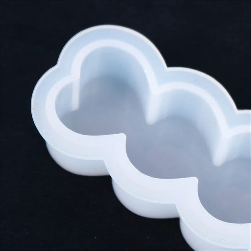 A clear silicone mold kit with heart-shaped cavities, showing the molds from a top view.