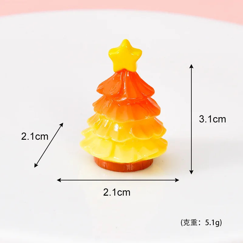 A small, layered orange and yellow resin Christmas tree charm with a gold star topper.