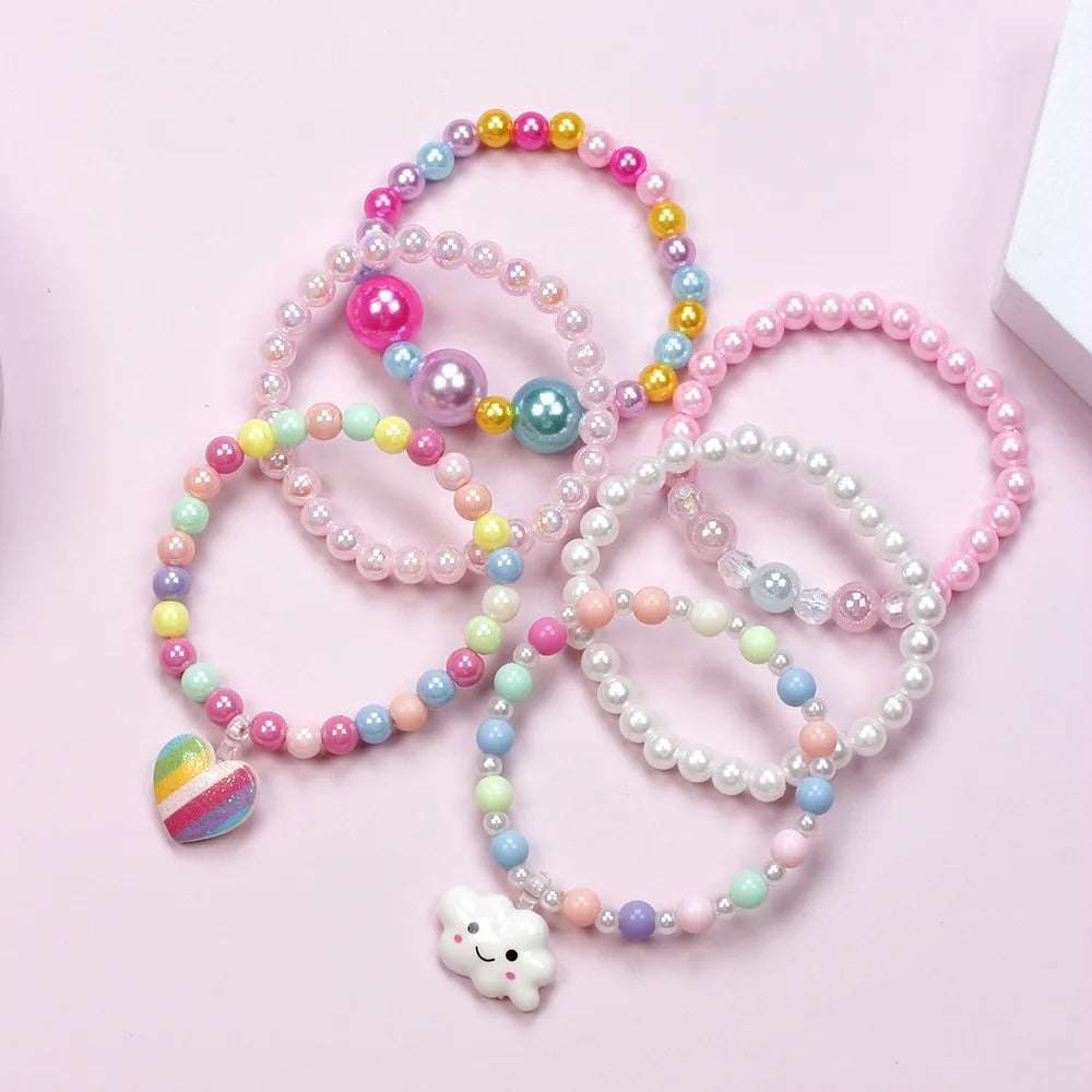 A set of six beaded bracelets featuring various pastel colors including pink, purple, yellow, and blue stones.