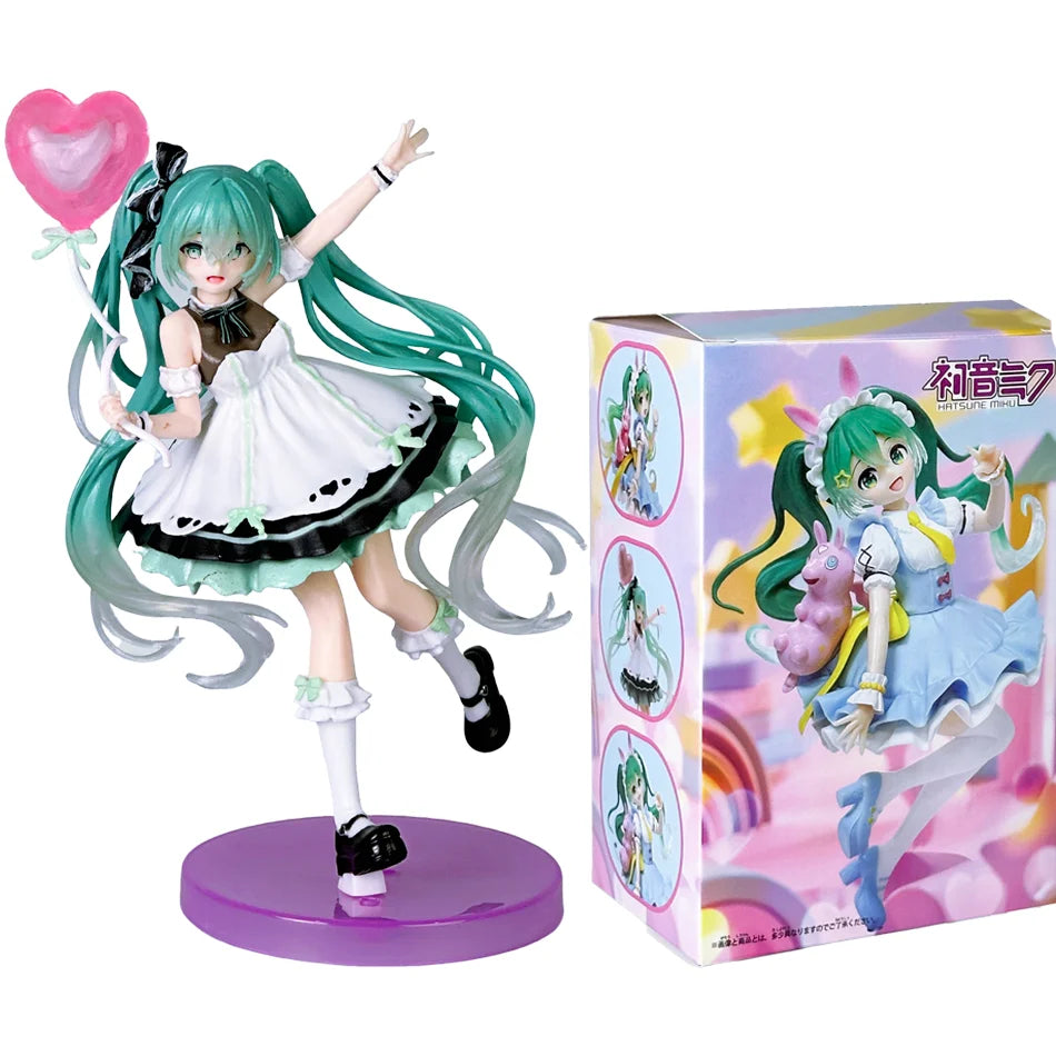 A PVC collectible figurine of Hatsune Miku in a light blue dress and green hair, standing on a purple base.