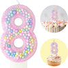 Pink glitter number 8 birthday candle set with frosting cupcakes