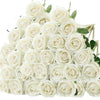 A bouquet of white artificial roses with green leaves.