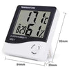 A white LED digital thermometer and hygrometer with an alarm clock display showing 17.6 degrees.