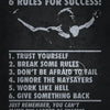 A black and white motivational canvas print featuring Arnold Schwarzenegger's 6 rules for success.