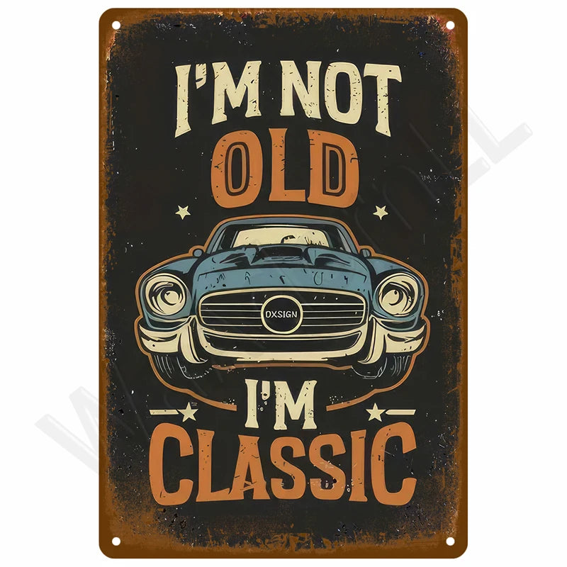 A vintage retro metal wall sign with distressed orange and black text that reads I'm not old I'm classic above a stylized car