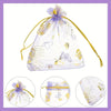 A clear mesh bag tied with gold string and purple glitter, containing a set of pink butterfly pendants.