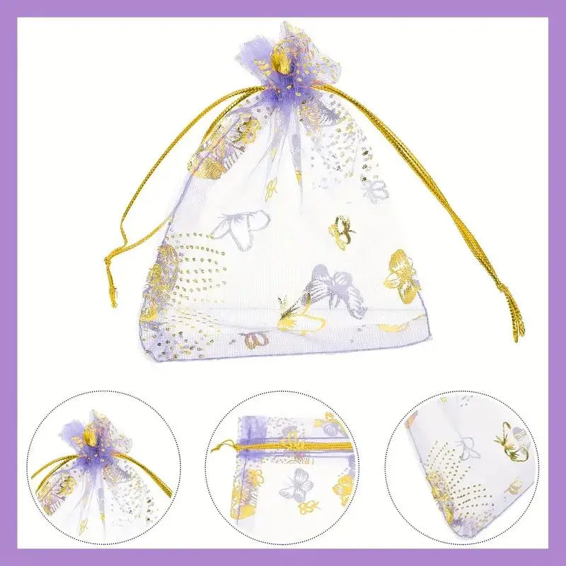 A clear mesh bag tied with gold string and purple glitter, containing a set of pink butterfly pendants.